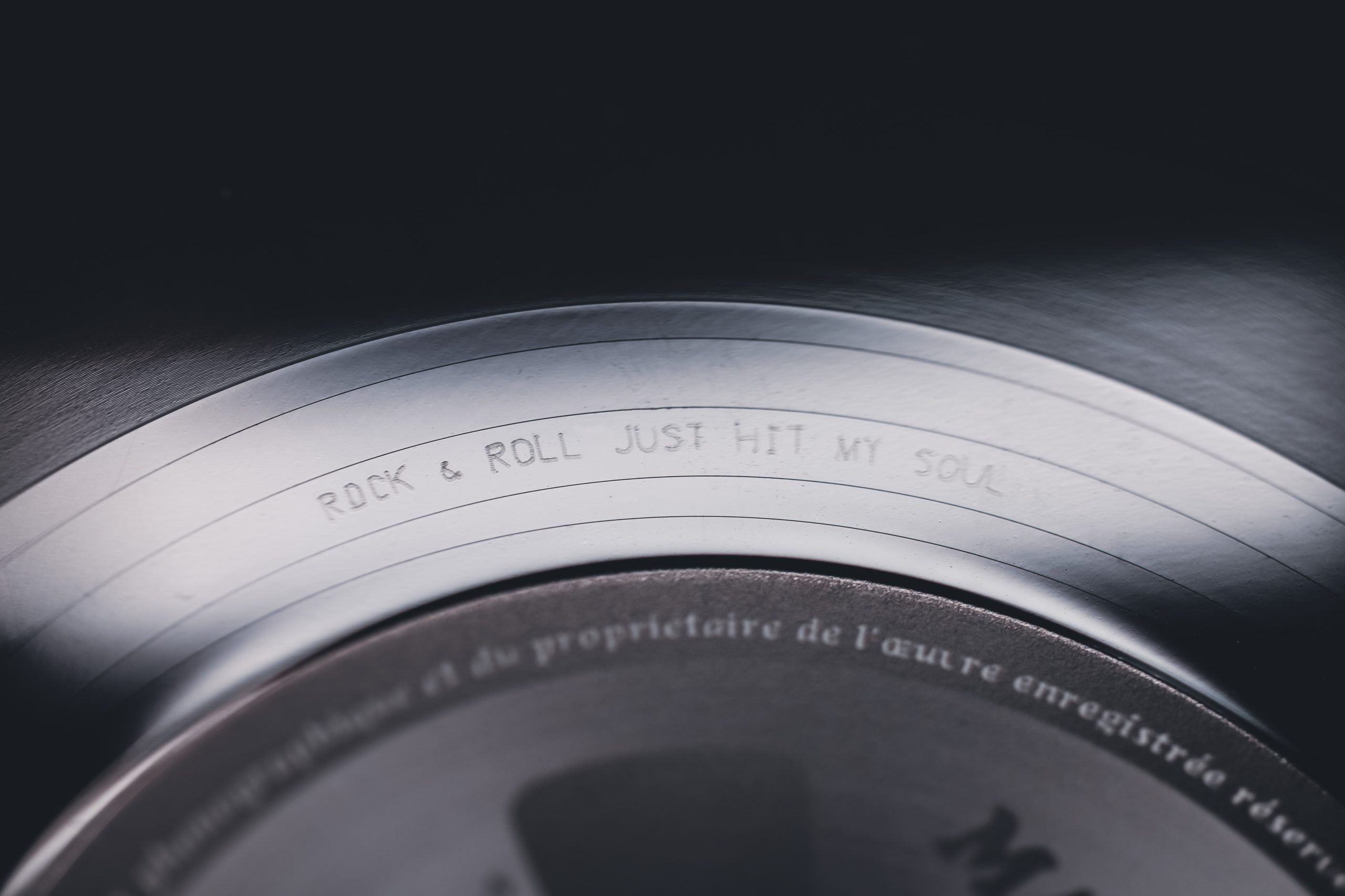 Close-up of the vinyl runout groove engraving for ‘Night Angel’ album – ‘Rock & Roll just hit my Soul"